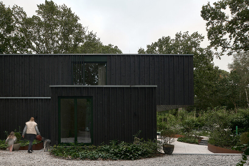 floating timber volume crowns forest house by kumiki architecture in the netherlands