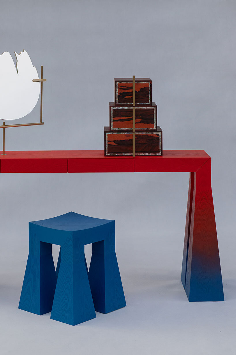 gradient finishes coat ash wood in this contemporary vanity table interpretation