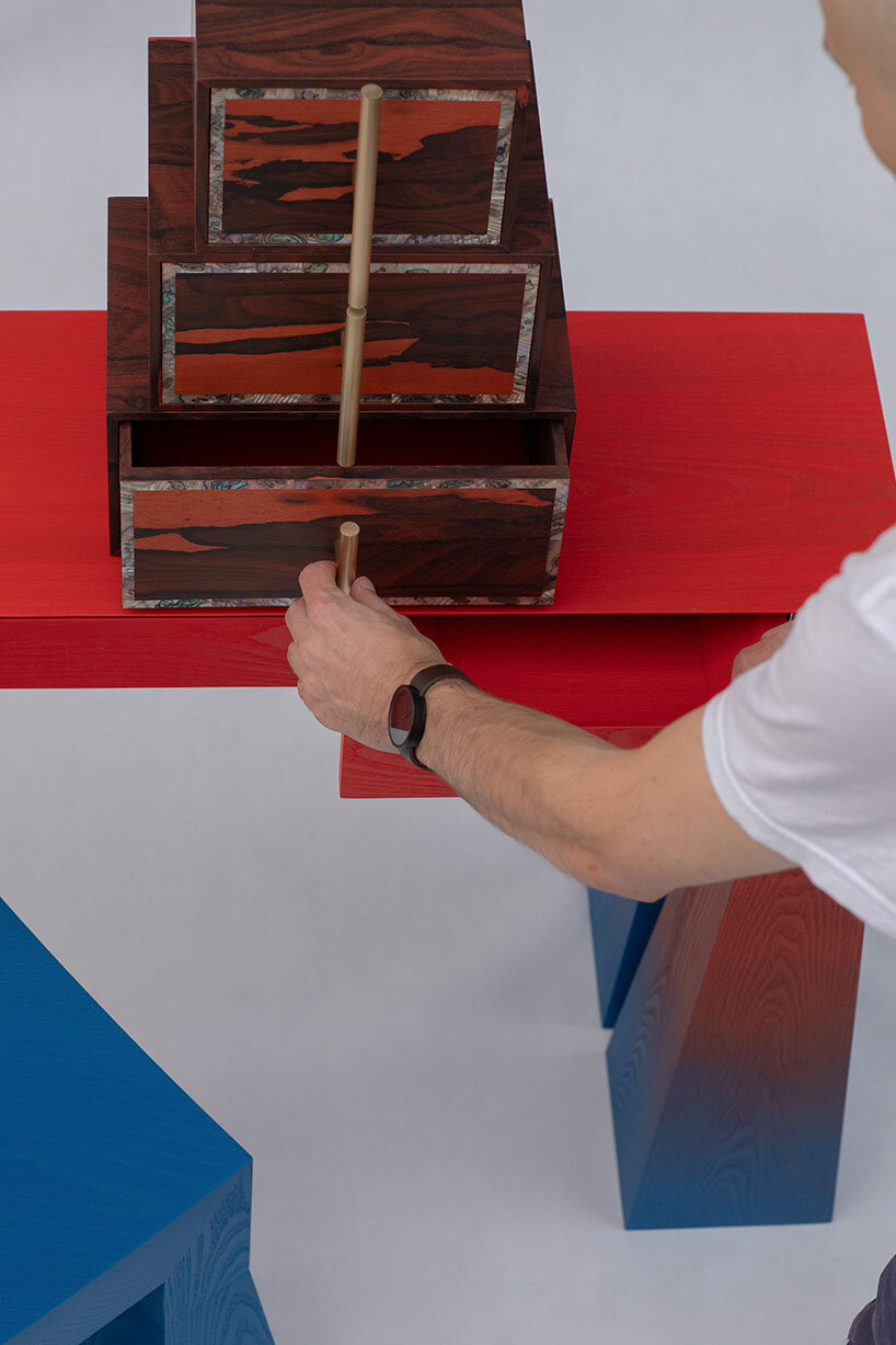 gradient finishes coat ash wood in this contemporary vanity table interpretation