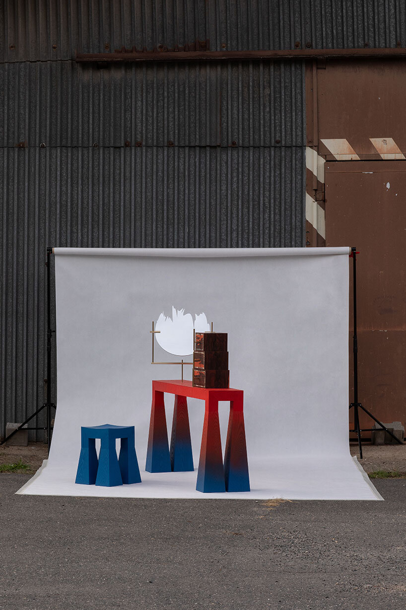 gradient finishes coat ash wood in this contemporary vanity table interpretation