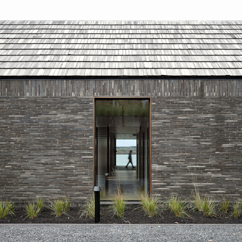 atelier échelle coats lakeside gallery residence in dark clay bricks, nodding to québec's barns