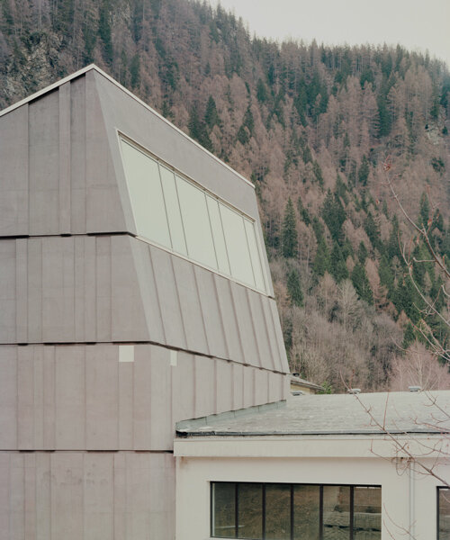 ES-arch designs spluga climbing gym as concrete monolith in northern italian mountains