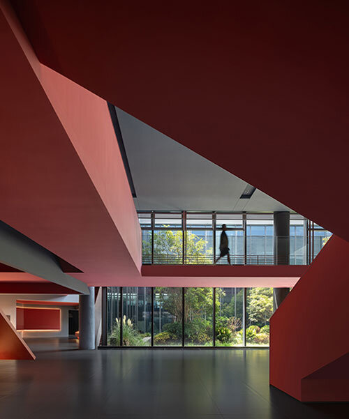 red cantilevered volumes outline one house design's shanghai techstorm exhibition hall