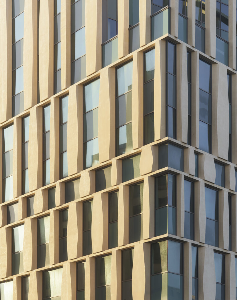 sculptural concrete columns define cino zucchi architetti’s office building in bordeaux