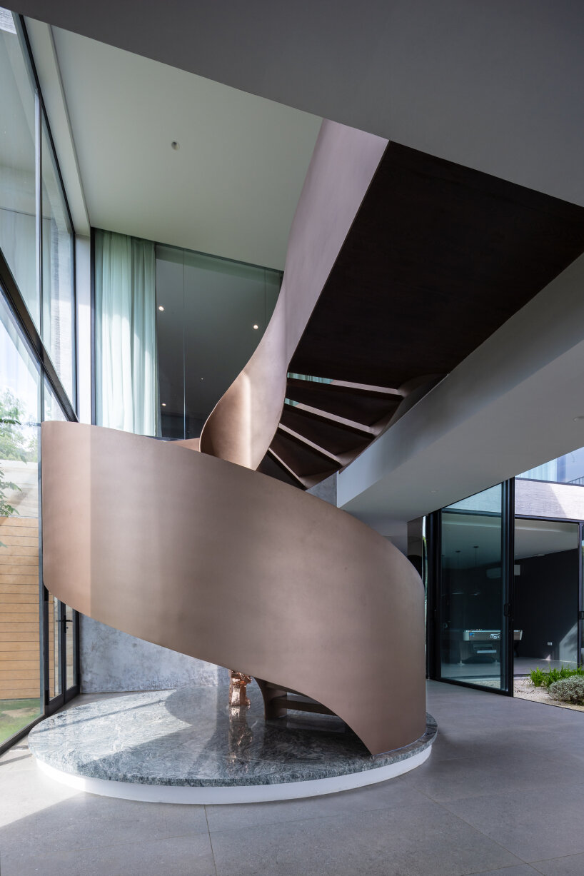 garden courtyards wind through stacked cubes of idee architects' vietnam hillside house