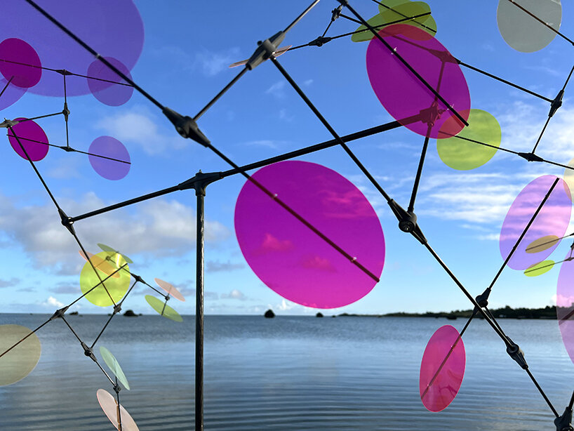 vincent leroy's multicolored installation turns japanese beach into chromatic landscape