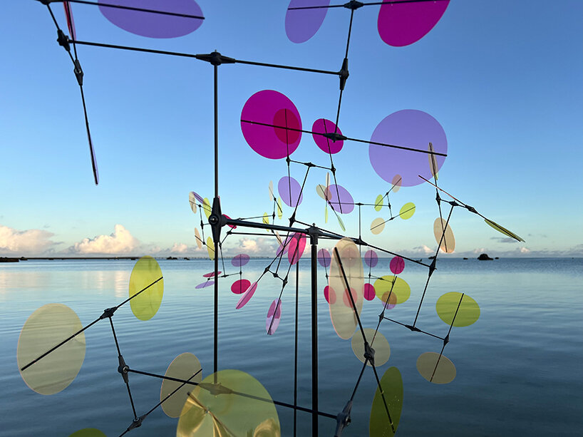 vincent leroy's multicolored installation turns japanese beach into chromatic landscape