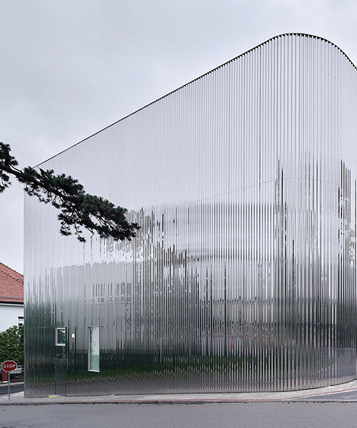 SLAS architekci wraps concert hall in poland with shimmering steel facade