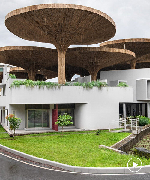 bamboo parasols crown communal hub at TAPMI campus in india by the purple ink studio