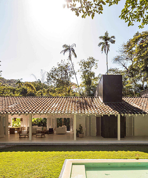 brazilian white residence unfolds under L-shaped roof in felipe hess arquitetos’ renovation