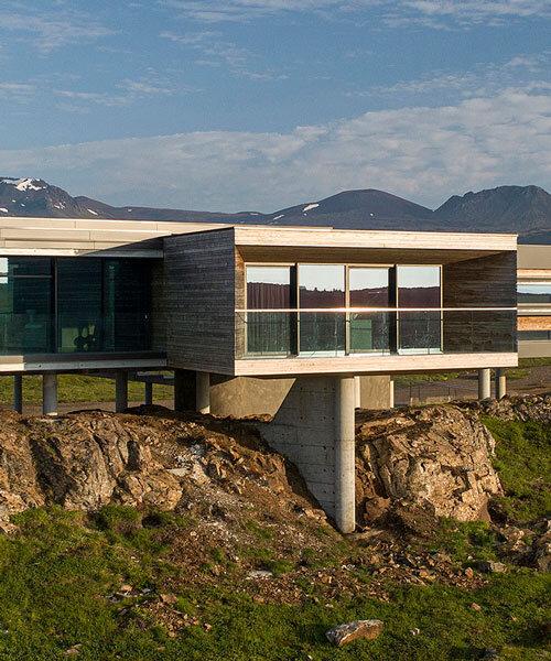 gudmundur jonsson's residence rests on columns along mountainous icelandic landscape