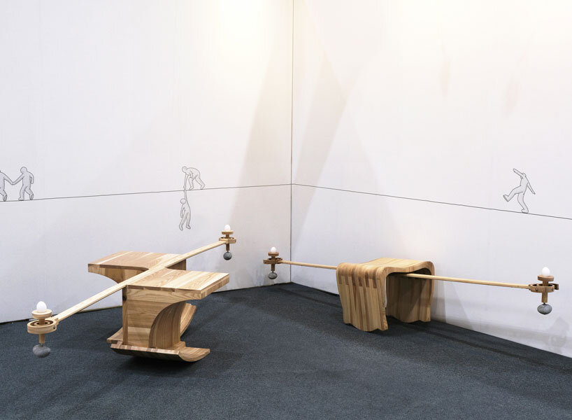 halfway serious wooden chair transforms sitting into a performative act of balance