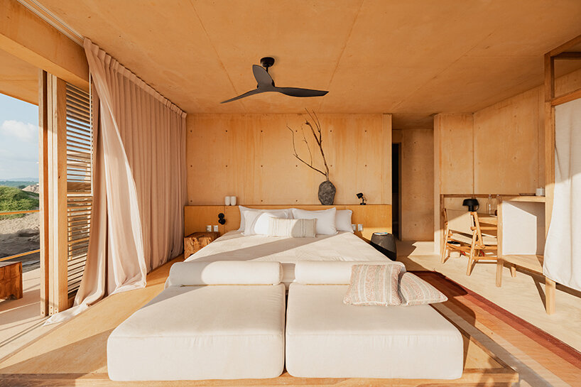 kymaia hotel's sandy, stepping suites emerge from coast of puerto escondido, mexico
