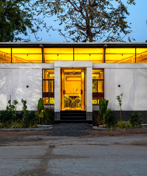 inverted winged hip roof cantilevers over reconstructed office space by compartment S4