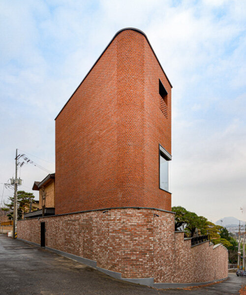 monolithic brick-clad annex by LKSA expands existing residence in korean mountains