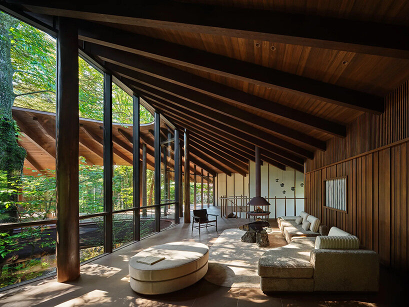 piloti structure suspends villa by and to architects above japan's forest landscape