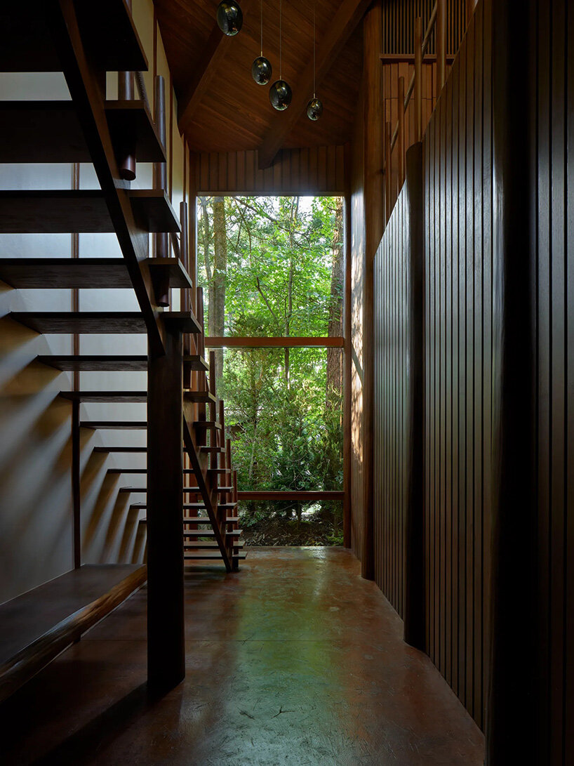 piloti structure suspends villa by and to architects above japan's forest landscape