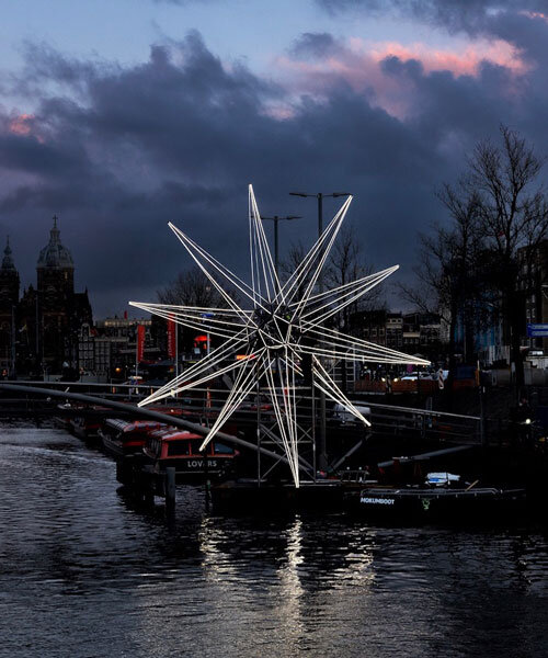 polaris glowing star installation lights up in the heart of amsterdam