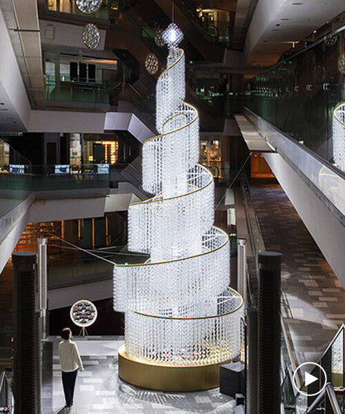 spiral christmas tree by yuji okitsu illuminates tadao ando's japanese commercial complex