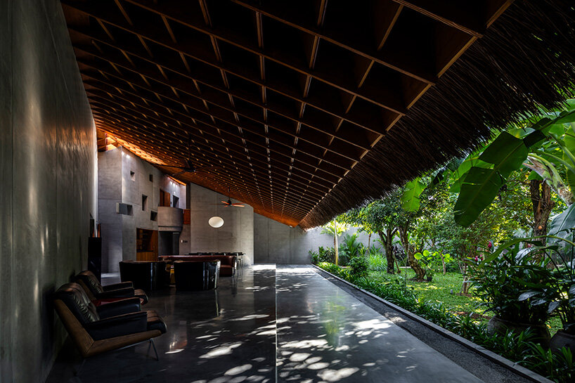 timber waffle roof shields constellation of living spaces in vietnamese residence by kientruc o