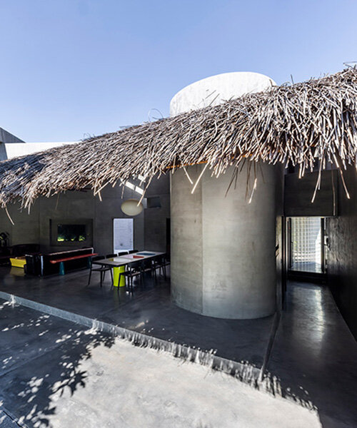 timber waffle roof shields constellation of living spaces in vietnamese residence by kientruc o