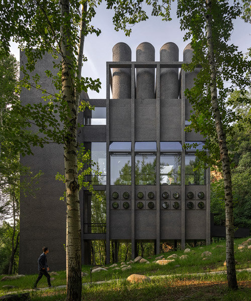 vector architects illuminates 'wulingshan' hot spring spa with brutalist light wells