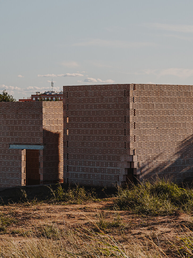 cross-shaped perforations filter light through bona fide taller’s ceramic pavilions in valencia
