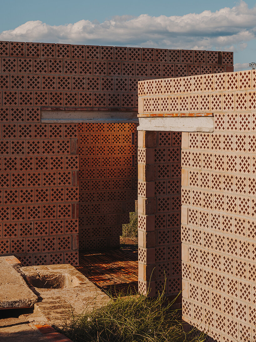 cross-shaped perforations filter light through bona fide taller’s ceramic pavilions in valencia