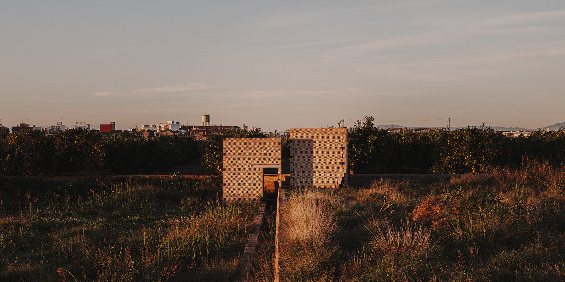 cross-shaped-perforations-light-bona-fide-taller-ceramic-pavilions-valencia-01-20-2025-designboom-1800-01