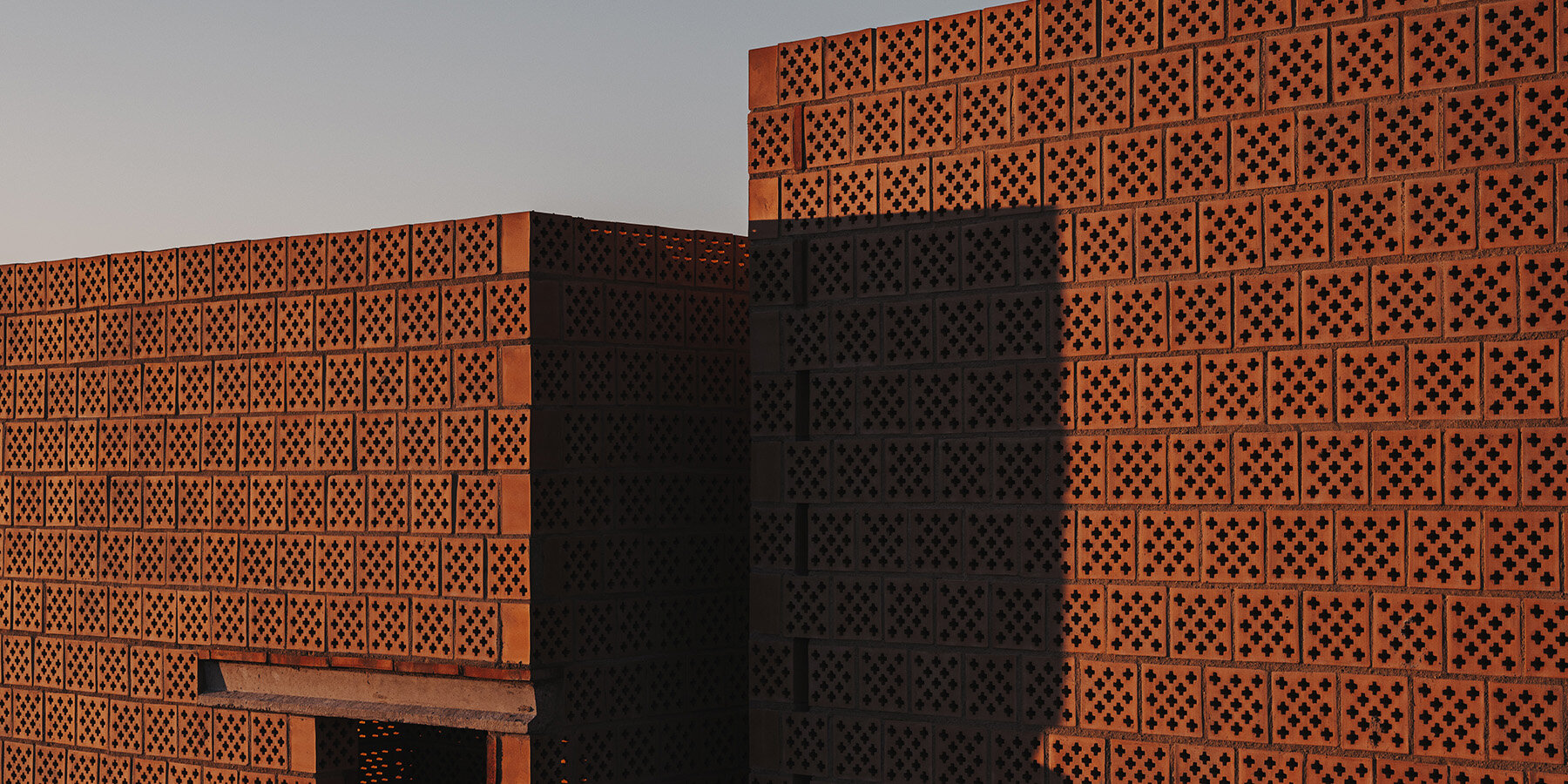 cross-shaped-perforations-light-bona-fide-taller-ceramic-pavilions-valencia-01-20-2025-designboom-1800-02