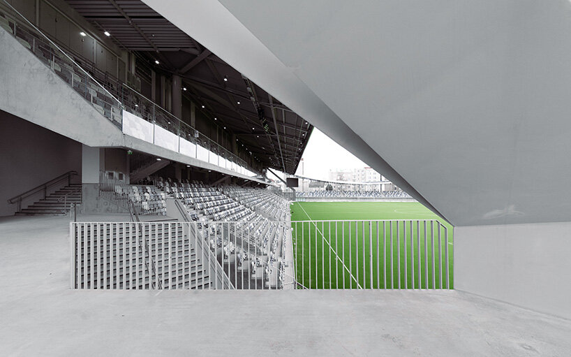 finland's first hybrid stadium by JKMM architects fuses residential, retail, and public spaces