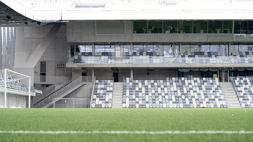 finland's first hybrid stadium by JKMM architects fuses residential, retail, and public spaces