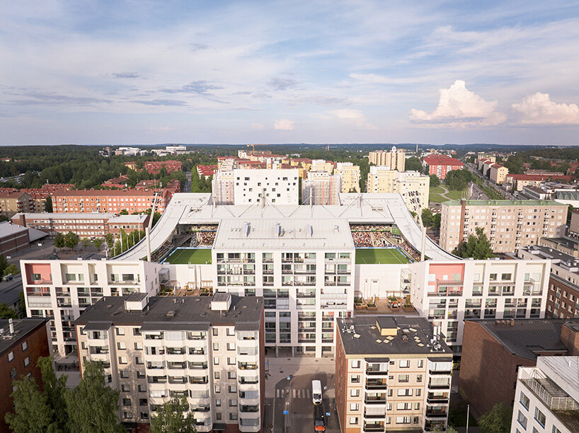 finland's first hybrid stadium by JKMM architects fuses residential, retail, and public spaces