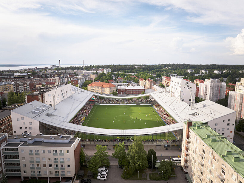 finland's first hybrid stadium by JKMM architects fuses residential, retail, and public spaces