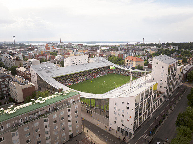 finland's first hybrid stadium by JKMM architects fuses residential, retail, and public spaces