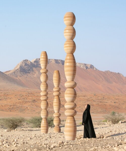 sculpted from sand, karim + elias' desert relics installation rises like ancient totems in UAE