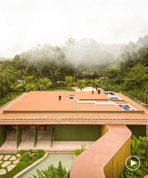 dry pink concrete residence by mf+arquitetos emerges from lush forest in rio de janeiro