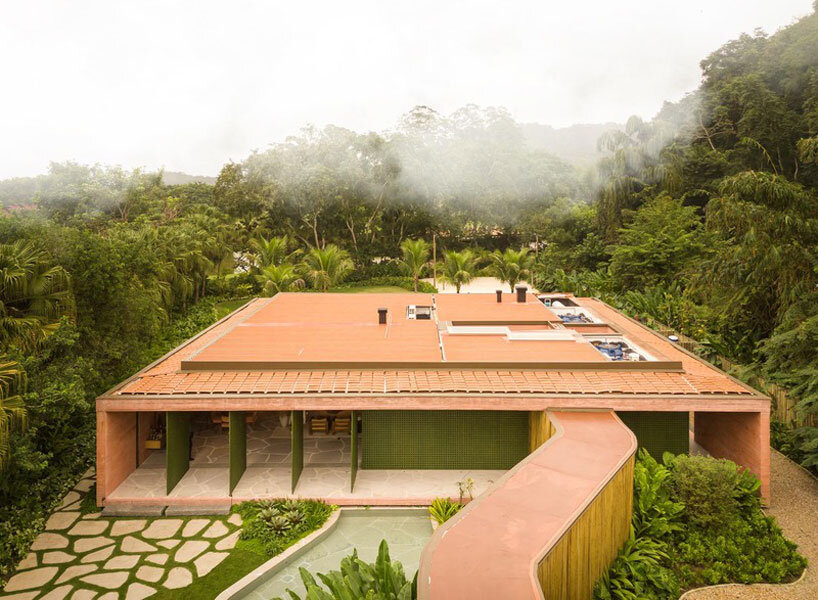 MF+Arquitettos' dry pink concrete residence emerges from Rio de Janeiro's lush jungle