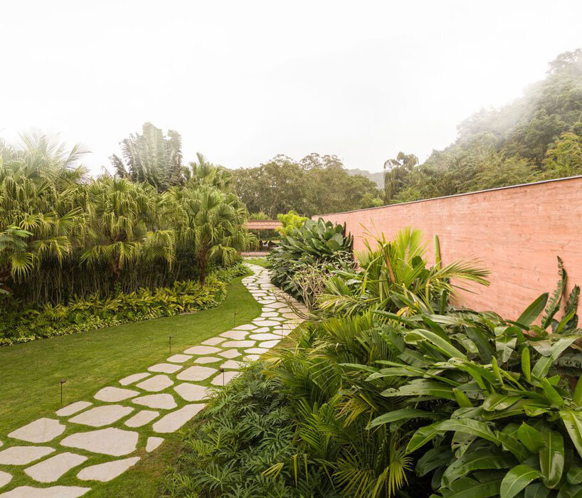 MF+Arquitettos' dry pink concrete residence emerges from Rio de Janeiro's lush jungle