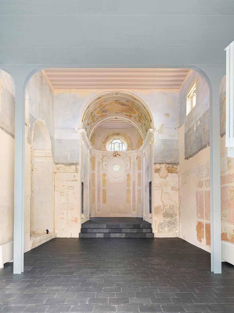 light blue steel structure by caarpa transforms historic italian church into event hall