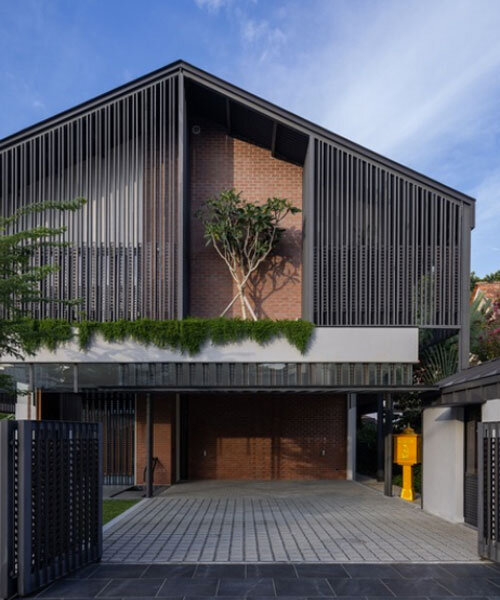 three stepped gable roofs top tebar layar house in malaysia by m j kanny