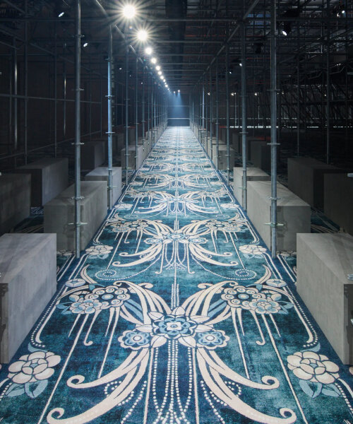 AMO surrounds prada FW25 men's show with scaffolding design & catherine martin's carpet