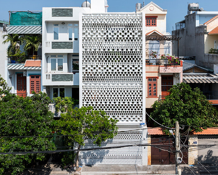 sanuki daisuke architects redefines vietnamese tube house with rhythmic light steel shades