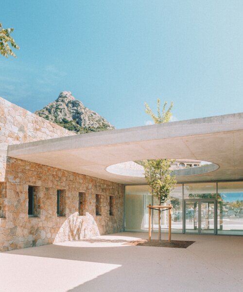 amelia tavella’s granite-carved school in corsica unfolds along the valley's contours