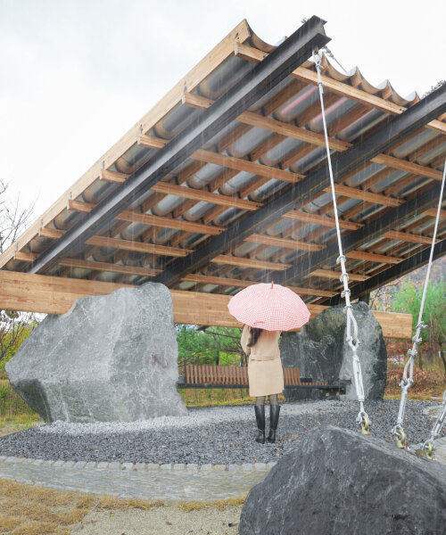 SO? rests wood & metal canopy atop rocks for 'urban interior' pavilion in south korea