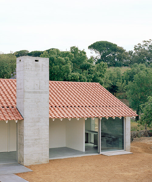 arquitectura-G combines concrete garage with residence beneath tiled roof in portugal