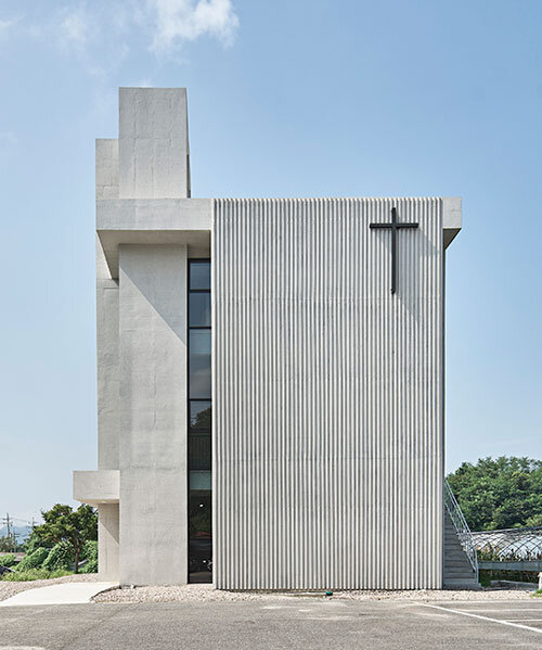 three stacked concrete slabs outline birye church by SML in korea