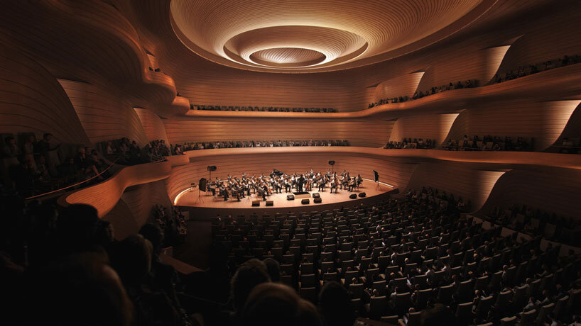 bjarke ingels group drapes undulating roof over opera and ballet theater of kosovo