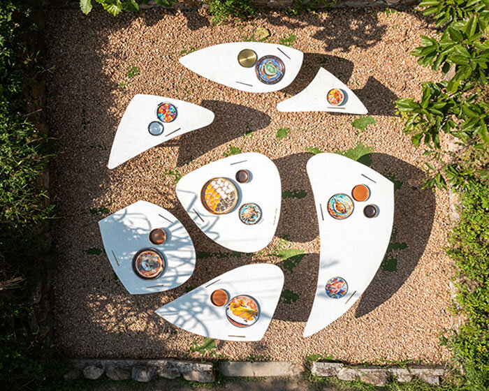 AI illustrations of food adorn vibrant mosaic plates for dining table installation in hong kong