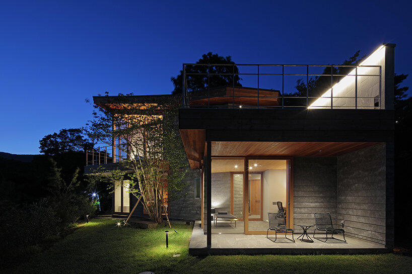 hybrid live-work spaces compose stone residence by FEDL in japanese hillside